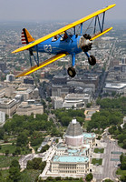 A pair of Boeing PT-17 Stearmans over the US Capitol Building   123 is piloted by Rick Conn - 484 flown by John Potock. Photo - David F Brown