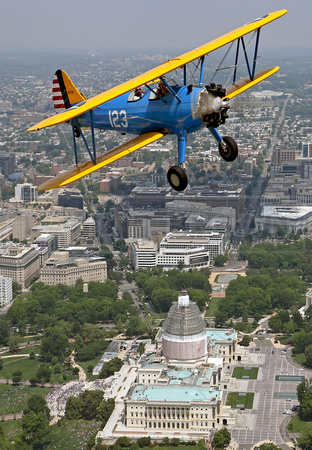 A pair of Boeing PT-17 Stearmans over the US Capitol Building   123 is piloted by Rick Conn - 484 flown by John Potock. Photo - David F Brown
